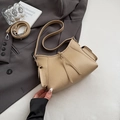 Beige litchi texture shoulder bag with dual decorative pockets and versatile straps - Khaki