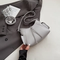 Grey litchi leather underarm bag with side pockets and decorative tassels on blazer - Gray