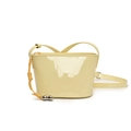 Pale yellow patent leather bucket bag with glossy finish and heart charm strap - Yellow