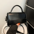 Minimalist black glossy leather crossbody bag with top handle and vintage finish - Black
