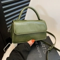Olive green vintage crossbody bag with wrinkled glossy texture and a curved handle - Green