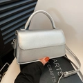 Silver metallic textured small crossbody bag with top handle in a minimalist style - Silver