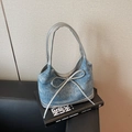 Blue denim tote bag with silver bow accent and metallic piping detail for women - Denim Blue
