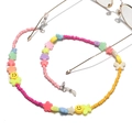 Detail van kleurrijke kralen brillenketting met smileys, sterren en bloemmotieven - Regenboog Ster Strik Stijl (2)