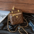 Deep brown quilted leather bucket bag with chain strap and camellia metal logo detail - Small / Coffee