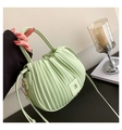 Detail of light green pleated bucket bag with square buckle and metallic gold hooks - Light Green