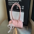 Pink Boston shoulder bag with lychee texture and pearl lace bow on a silver table - Pink (With Pearl Lace Pendant)