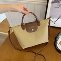 Beige oxford fabric tote bag with dark brown leather handles and adjustable strap - Khaki