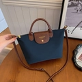 Dark blue nylon tote bag with brown leather handles and adjustable shoulder strap - Blue