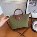 Olive green nylon tote bag with brown leather handles and adjustable shoulder strap - Green