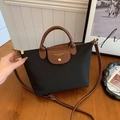 Black nylon tote bag with brown leather handles and adjustable shoulder strap - Black