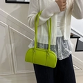 Neon green textured leather Boston shoulder bag with silver zipper and sleek handles - Green