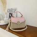 Pink faux leather and straw woven crossbody bag with gold circular lock and rope strap - Pink