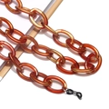 Detailed macro view of amber acrylic glasses chain with large oval resin links - Amber (8)