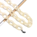 Detailed close-up of cream resin chain link with rubber loops for glasses - Cream (12)