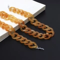 Minimalist amber acrylic eyewear chain with transparent silicone loops and metal hardware - Orange