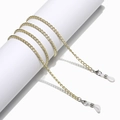 Detail of golden metal eyewear chain featuring silver lobster clasps and white silicone loops - Yellow