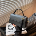 Classic black PU leather crossbody bag with top handle and gold-tone buckle details - Black
