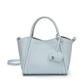Light blue bucket bag with wavy top, leather elephant charm, and branded logo detail - Blue