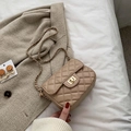 Elegant beige quilted crossbody bag with gold chain strap and metal rotary lock finish - Khaki Medium