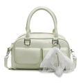 Light green bowling bag featuring matte texture and a delicate white lace bow accessory - Green