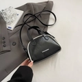 Mini black bowling handbag with white contrast piping and adjustable shoulder strap - Black