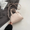 Chic beige leather mini crossbody bag with top handles and brand logo print - Pink