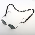 Retro round black sunglasses with chunky acrylic link chain lanyard on white background - Black