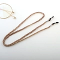 Detail of woven brown eyewear lanyard with non-slip rubber loops and silver hardware - Khaki