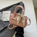 Pink lychee texture leather handbag with silver clasp and decorative floral silk scarf - Pink