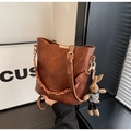 Vintage brown leather bucket bag with braided handle and plaid bunny charm detail - Large (With Pendant) / Brown
