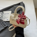 Chic cream-white leather satchel with red checkered scarf and elegant metal clasp - Off-white