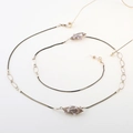 Elegant gold pearl snake chain glasses necklace with black cord and non-slip loops - Gold Pearl Metal Cage Style