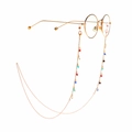 Golden eyewear chain with colorful crystal beads on round gold frames against white background - Golden Colorful Beaded Style (GL934)