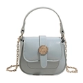 Mini light blue crossbody saddle bag with glossy texture and gold C-logo buckle - Blue