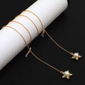 Catenella per occhiali in metallo dorato con ciondolo a stella e perla protettiva - Oro