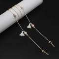 Detail of colorful ceramic beads and white tassel on dual-tone eyewear chain - White