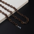 Close-up of tortoise shell acrylic eyeglass chain with silver lobster clasp and silicone loop - Brown Tortoiseshell Style (10)