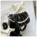 Detail of black pleated cloud bag with pearl handle and detachable shoulder strap - Black