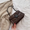 Dark brown leather chain crossbody bag with rivet details and geometric embossed patterns - Coffee