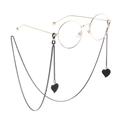 Gold round glasses with stylish black heart pendant chain accessory on white background - Black Heart Pendant