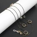 Catenella dorata per occhiali a doppio uso con perle di cristallo nero e ganci in silicone - Nero e Oro