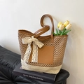 Handmade straw tote bag with brown leather pocket and large white lace bow detail - Khaki