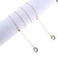 Elegant gold glasses chain featuring rhinestone-encrusted star and moon pendant charms - Gold Star Moon Style (GL821)