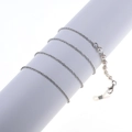 Minimalist pearl glasses chain with silver metal links and silicone loops on white prop - Silver