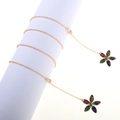 Golden metal eyewear chain with colorful flower pendants on white display stand - Gold Colorful Flower Style (GL816)