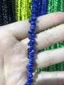 Detailed close-up of natural dark blue irregular stone beads for eyewear chains - Blue