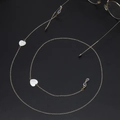 Golden eyewear chain with white heart shell charms on an elegant black matte background - White Heart Shell (GL706) / Gold