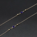 Detail of 70cm gold glasses chain with dark blue glass beads and frosted gold beads - Blue