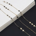 Elegant gold plated eyeglass chain with delicate metal star charms and silicone loops - Gold Star Style